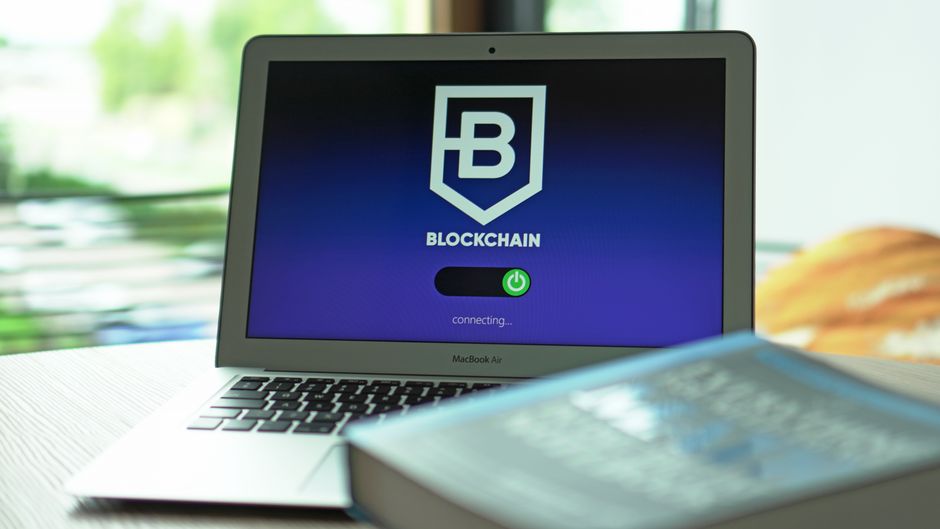 Laptop displaying blockchain application interface