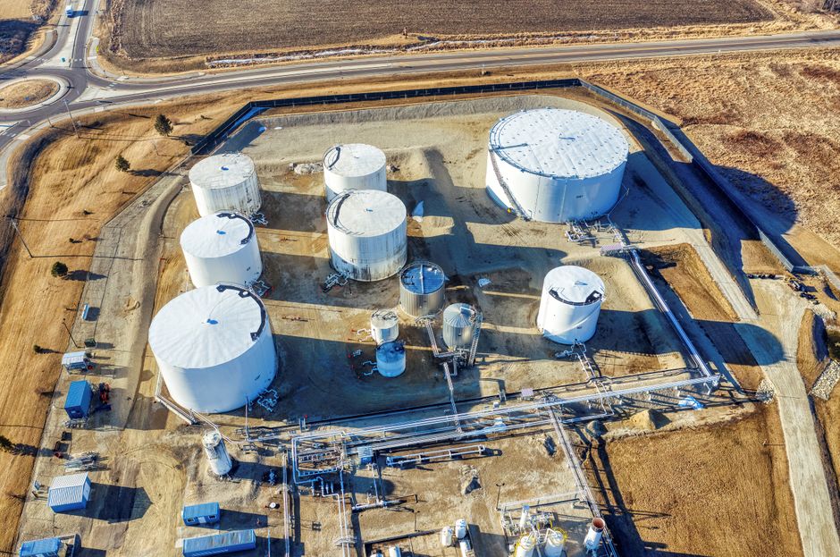 Aerial view of a large industrial plant with storage tanks