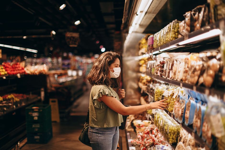 A shopper in a grocery store aisle