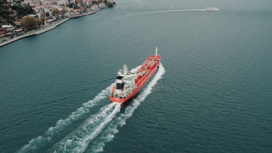 A cargo ship docked at an industrial port