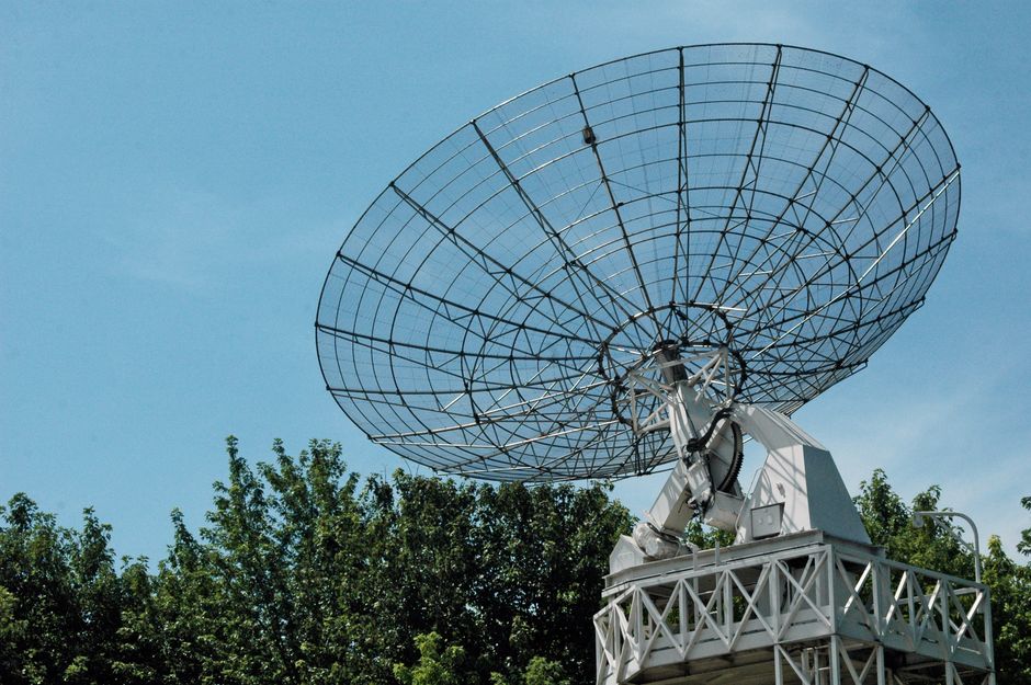 Satellite dish against a clear blue sky