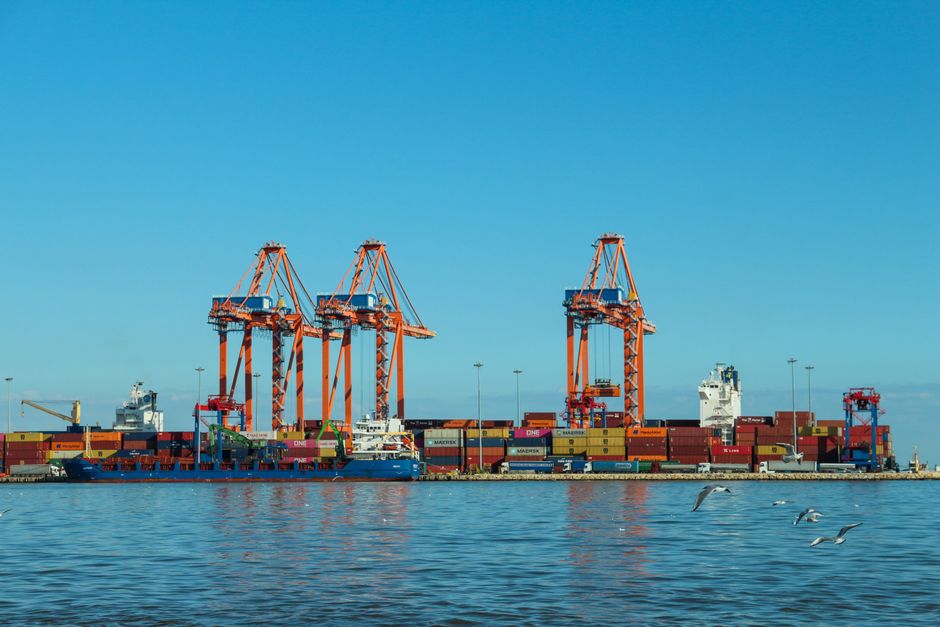 Colorful container port with large cranes and ships