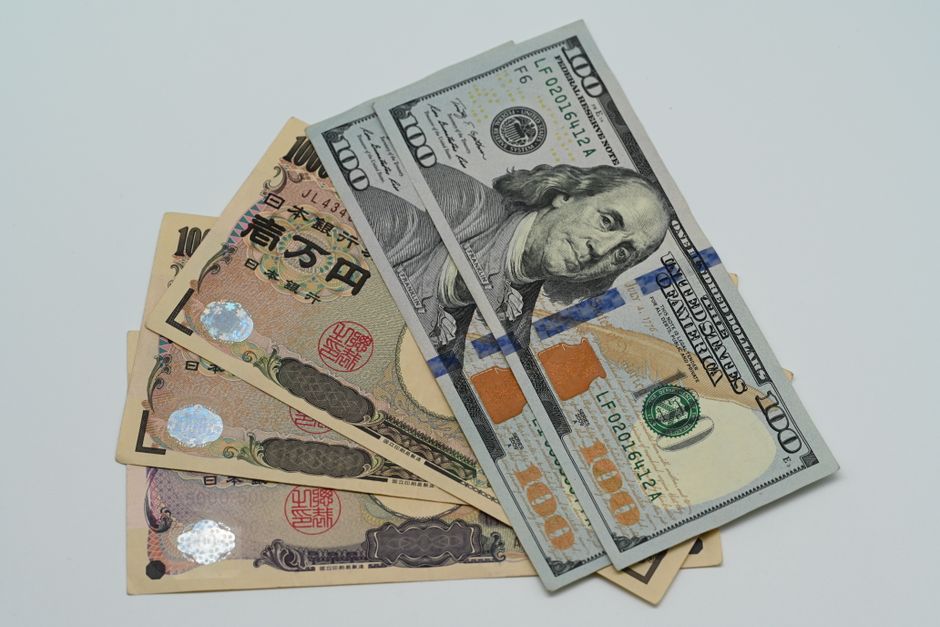 Currency exchange concept showing US dollars and Japanese yen