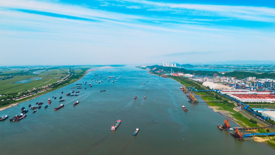 Aerial view of cargo ships navigating a busy maritime waterway
