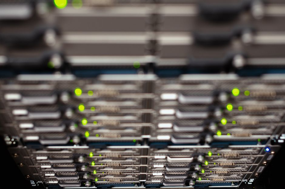 High-angle view of server cable trays in a modern data center, representing AI computing infrastructure.