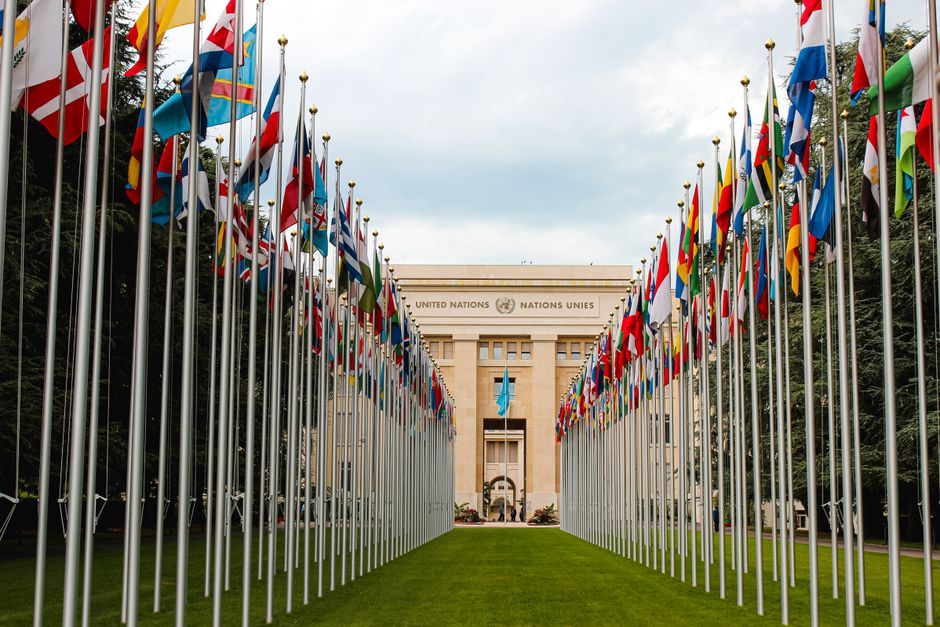 National flags on flagpoles outside an international organization headquarters