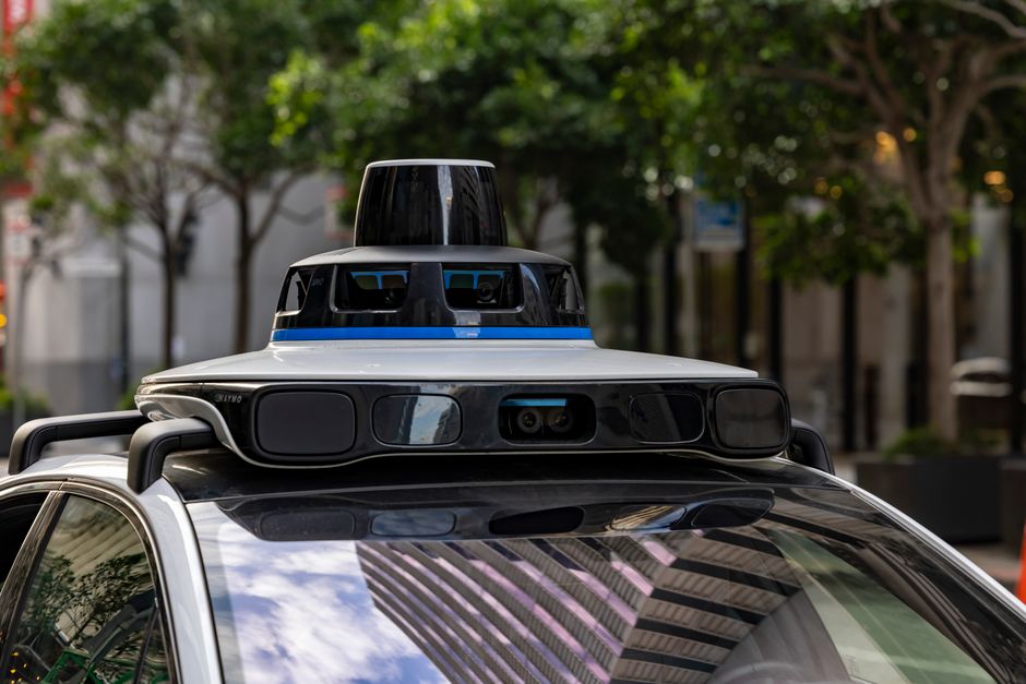 Close-up of sensor arrays mounted on the roof of an autonomous vehicle, showing the technology behind self-driving systems.