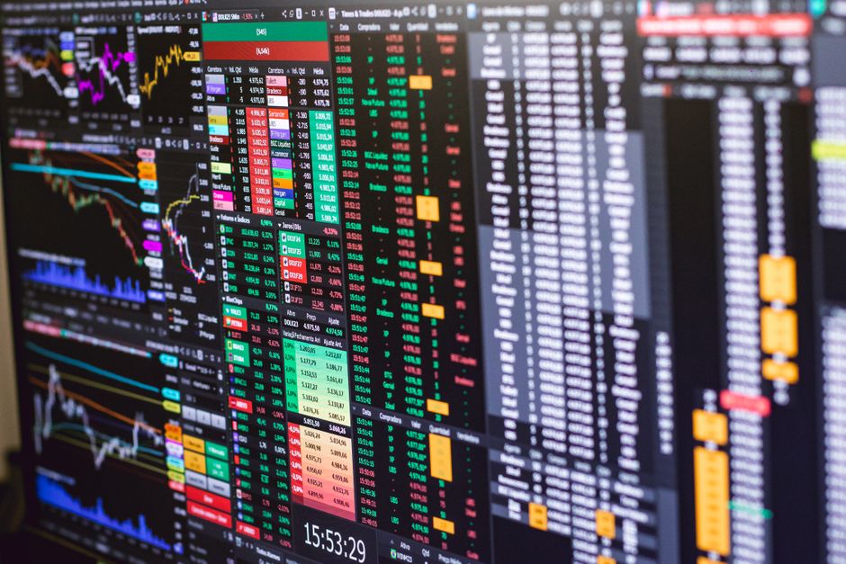 Financial trading screen with colorful market data charts
