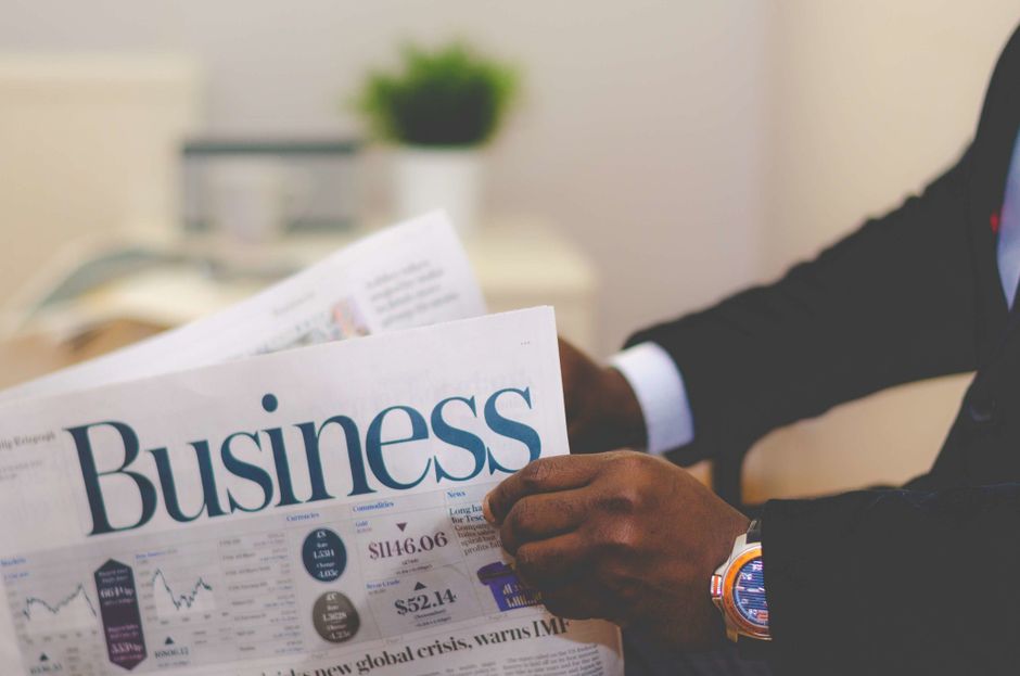 Financial headlines in a business newspaper