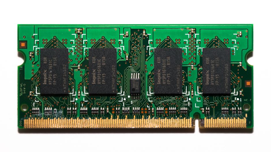 Top-down view of a computer memory module with detailed circuitry and gold contacts