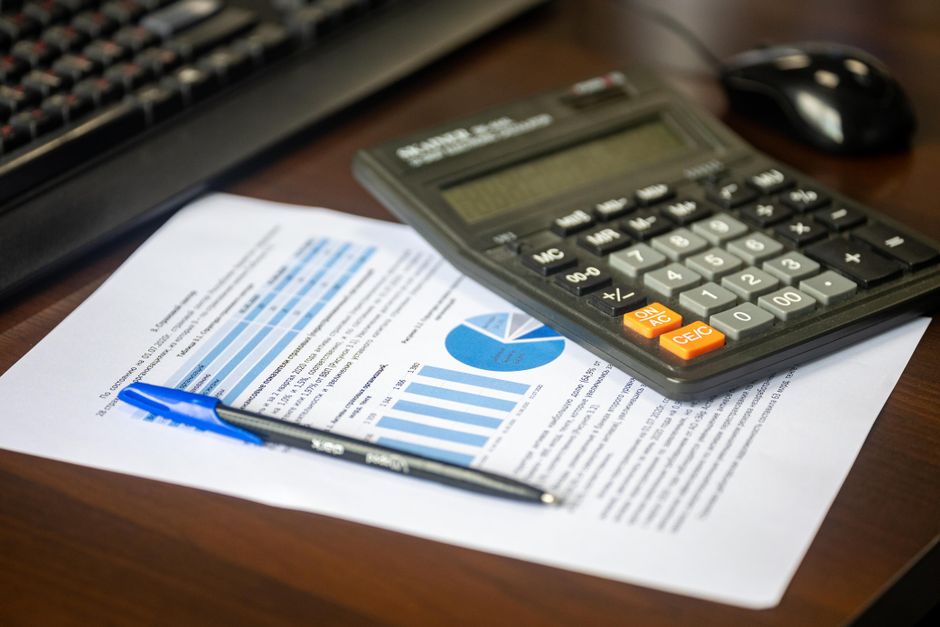 Financial report with calculator on a desk