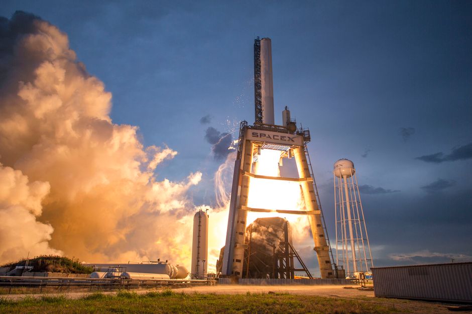 A SpaceX rocket standing upright on a launch pad against a colorful dusk sky, symbolizing the historic 2026 IPO and the approaching lockup expiration test.