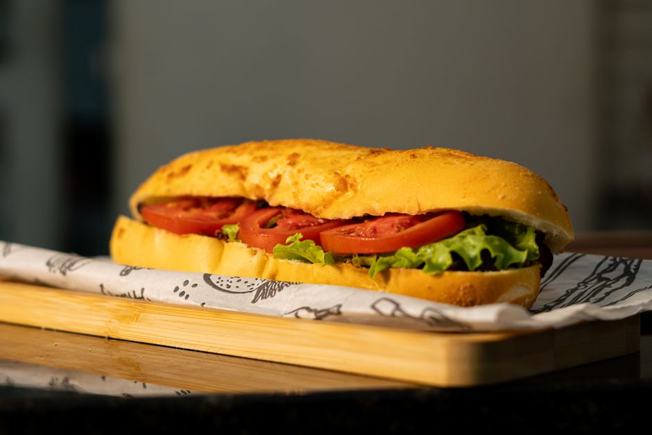 Fresh sub sandwich on a wooden board