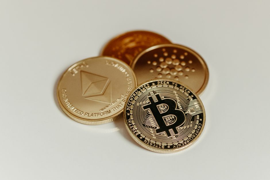 Cryptocurrency coins representing major digital assets, symbolizing the growing intersection of traditional finance and blockchain tokenization.
