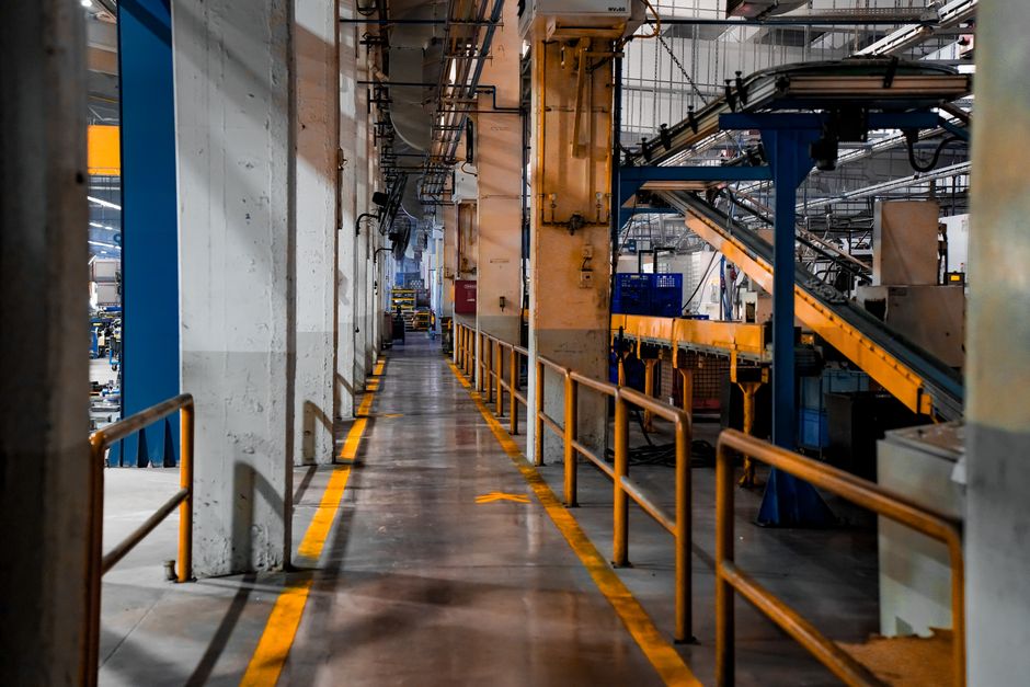 Industrial factory interior with conveyor belts and production equipment