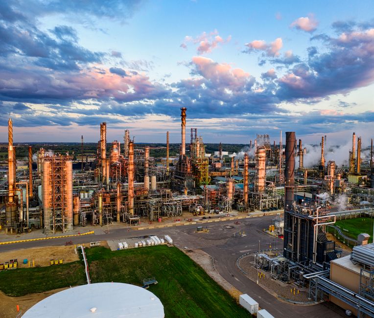 Aerial view of a petroleum refinery complex at dusk