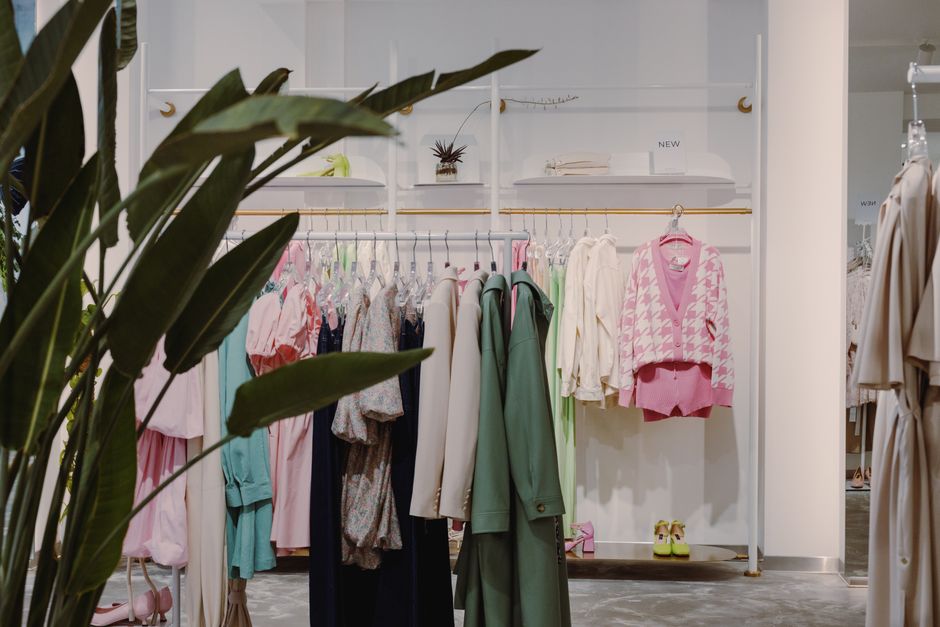 Vibrant clothing rack with diverse apparel in a contemporary boutique setting