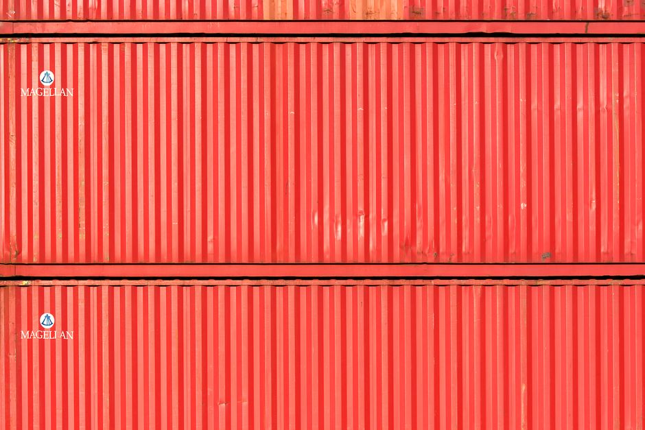 Red cargo containers stacked at port