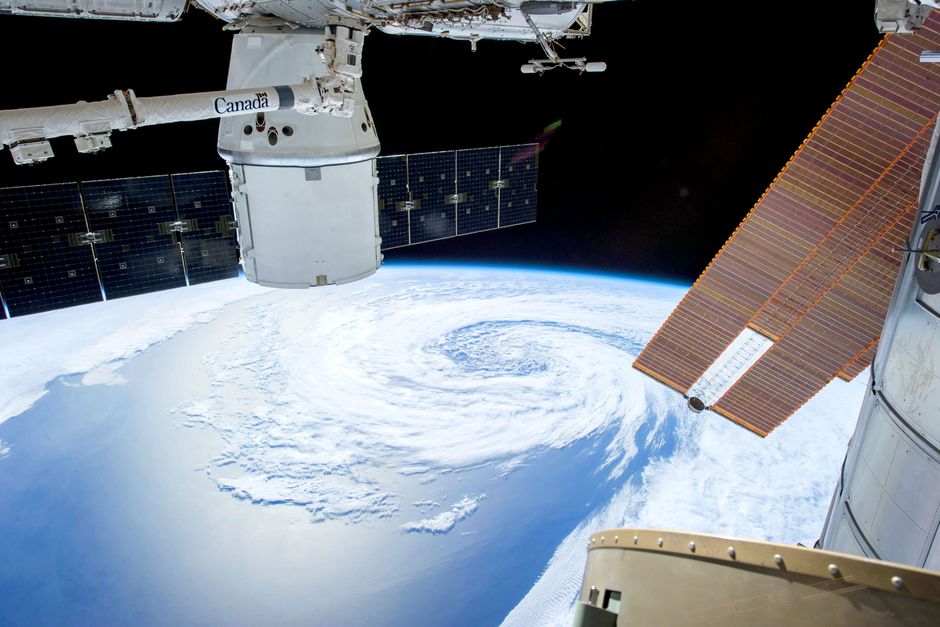 View of Earth from a space station with solar panels
