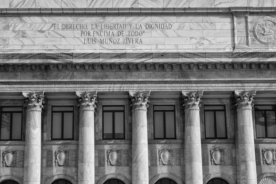Neoclassical government building facade with marble columns.