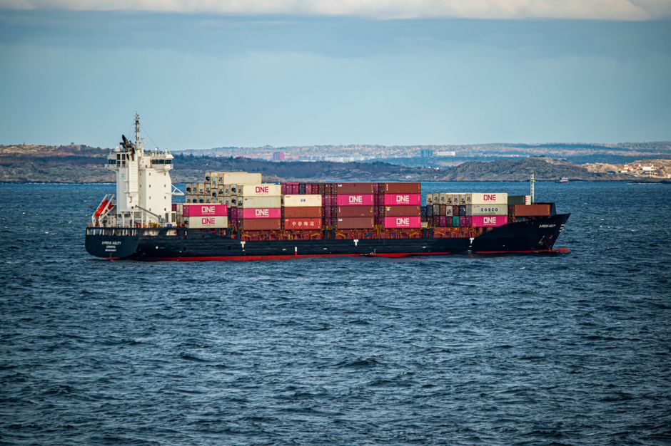 Large container ship on the open sea under a clear sky