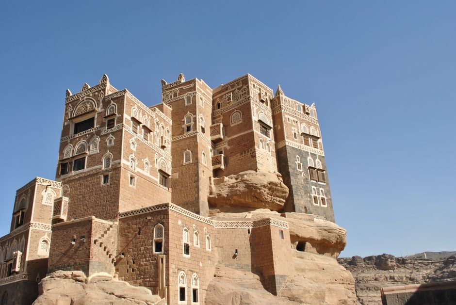 Dar al-Hajar rock palace in Yemen under a clear blue sky