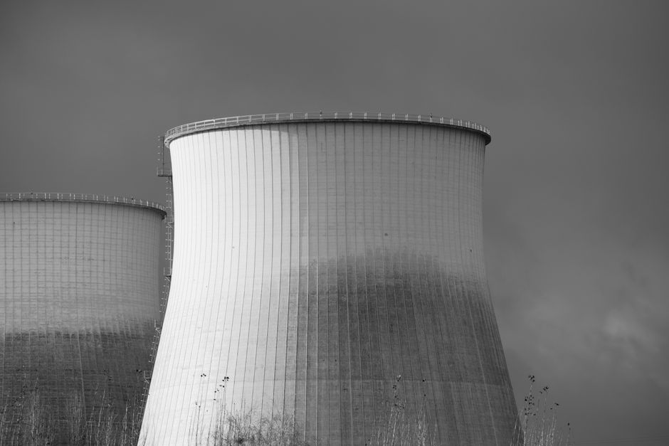 Black and white depiction of cooling towers at a nuclear power station.