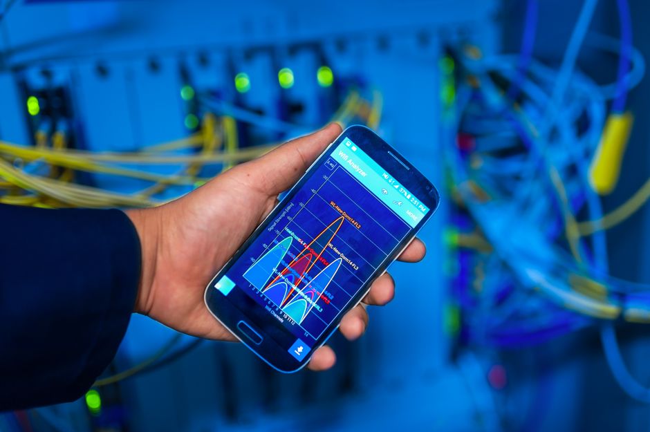 A smartphone displays network analysis for cloud and AI operations