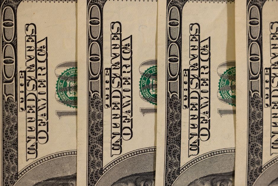 Close-up of US hundred dollar bills showcasing currency detail