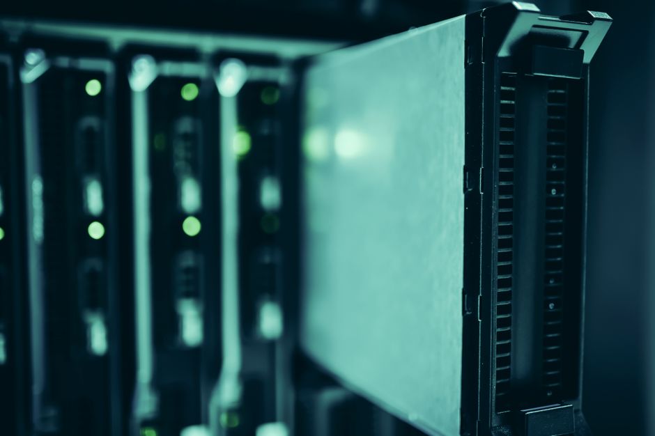 Server racks in a data center with blue lighting